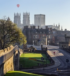 A Classic View Of York Minster And Bridge During Calm Sunny Morning