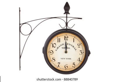 Classic vintage railway station clock isolated on white background. Retro antique timepiece.
