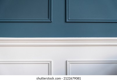 Classic wainscot wood decoration detail. Retro blue and white wooden wall panel background, closeup view. Interior room architecture design