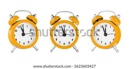 classic watch, pointer clock, Orange color alarm watch on isolated white background close up