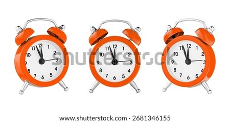 classic watch, pointer clock, Orange color alarm watch on isolated white background close up