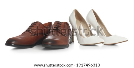 Classic wedding shoes for bride and groom on white background