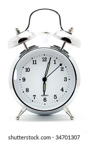 Classic White Alarm Clock Ringing At Six Oclock, Isolated Against A White Background