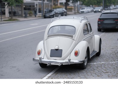 Classic White Blanche Vintage Car With a Sleek Rear Design Parked on The Street - Powered by Shutterstock