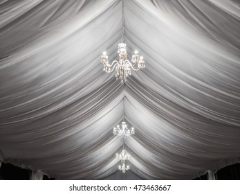 Classic White Chandeliers On Event Party Tent