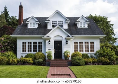 Classic White Clapboard House With The Red Brick Sidewalk