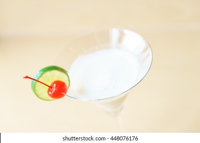 Classic white lady cocktail on wooden background