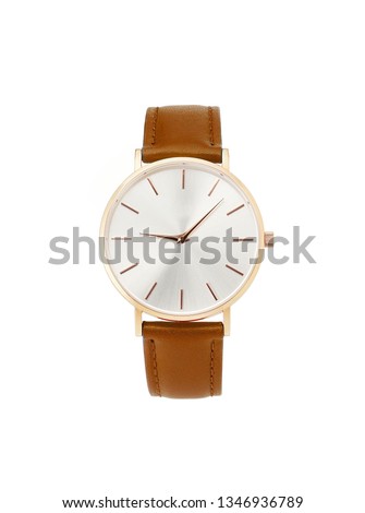 Classic women's gold watch with white dial, brown leather strap, isolate on a white background. Front view.