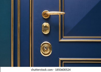 Classic Wood Entrance Door In Dark Blue With Carved Panels And Gold Patina