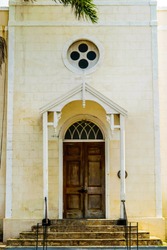 Classic Wooden Double Doors At The Top Of Church Steps. Front Entrance To An Old Anglican Church With Symbolic Cross. The Falmouth Parish Church Of St Peter The Apostle, In Trelawny Parish, Jamaica