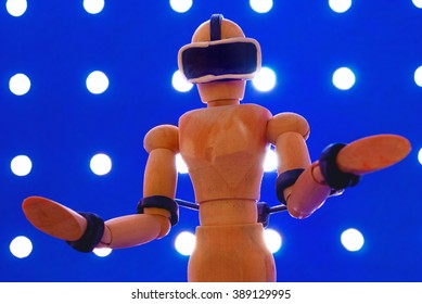 Classic wooden dummy uses a plasticine virtual reality headset. - Powered by Shutterstock