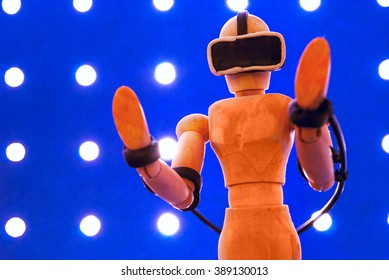 Classic wooden dummy uses a plasticine virtual reality headset. - Powered by Shutterstock