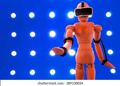 Classic wooden dummy uses a plasticine virtual reality headset. - Powered by Shutterstock