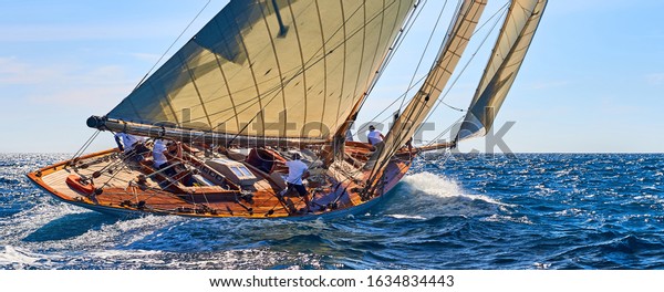 Classic yacht under full sail at the regatta.\
Sailing yacht race