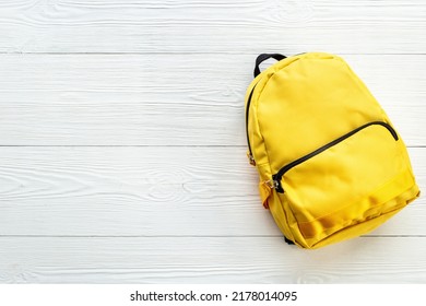 Classic Yellow School Backpack Top View. Educational Objects Background.