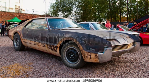 Classical American vintage muscle car\
1966 Oldsmobile Toronado Deluxe Coupe in rat style on Original Meet\
Show. Russia, St. Petersburg, September 7,\
2019.