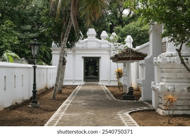 Classical Archway Corridor in the Garden of Pajimatan Imogiri, Yogyakarta, Showcasing Traditional Javanese Architecture in a Peaceful, Historic Setting - Powered by Shutterstock