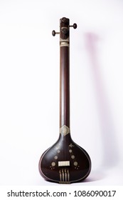 A classical Bangladeshi and Indian musical instrument called Tanpura on white background.