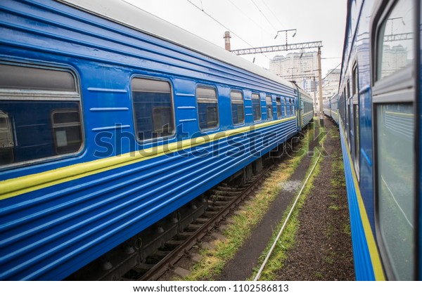 Classical cars of passenger train from outside.\
Many passenger cars.