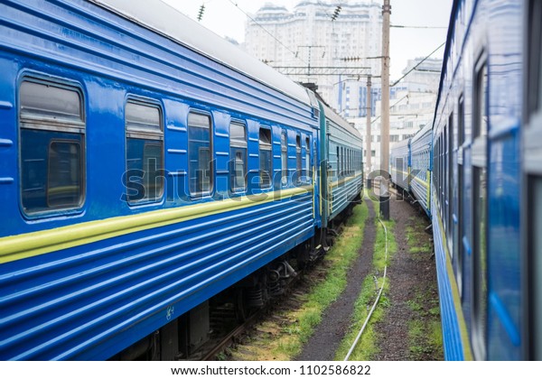 Classical cars of passenger train from outside.\
Many passenger cars.