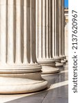 Classical columns white marble. Pillars in a row. Athens Greece Academy neoclassical building entrance colonnade.