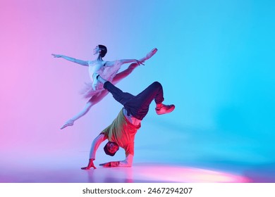 Classical and Contemporary Dance Duo. Duet of ballerina and street dancer, man and woman dancing on gradient background in neon light. Concept of classical and modern dance, performance - Powered by Shutterstock