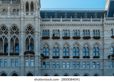 Classical facade with repeated windows and pavement
