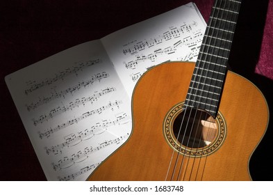 Classical Guitar And Sheet Music Still Life