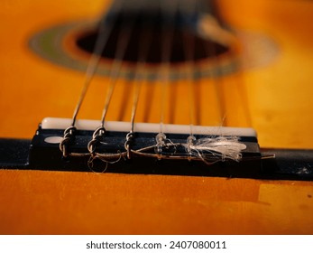 Classical guitar strings and frets close up shot selective focus