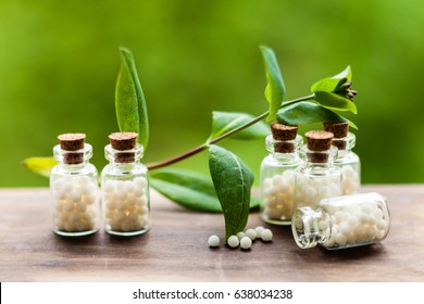 Classical Homeopathy globules in vintage bottles and nature leaves