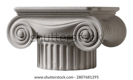 Classical ionic column capital with volutes and fluted stone pillar top