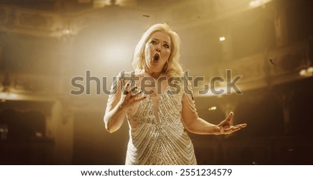 Classical Lead Singer Performs with a Mix of Emotions and Energy. Audience Sitting in a Theater, Watching a Powerful Music Show by a Talented Female Opera Star. Mesmerizing Confetti Falling on Stage