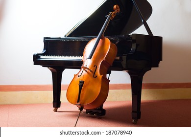 Classical music concept: violin leaning on a piano