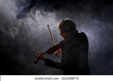 Classical Musician Violinist With A Musical Instrument Violin, Shot In Studio On Black Background