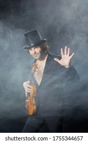 Classical Musician Violinist With A Musical Instrument Violin, Shot In Studio On Black Background