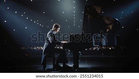 Classical Piano Concert: Under the Spotlight, Pianist Delivering a Powerful Performance on the Grand Piano. Elegant Stage Setting Complements His Passionate Playing, Leaving the Audience Happy