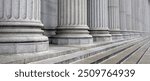 Classical pillars row in an office building facade. Stone colonnade and stairs detail. 