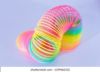 Classical slinky spring toy isolated on the white background
