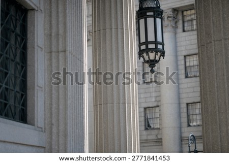 Classical Stone Columns And Hanging Lantern On Courthouse Facade In Manhattan, Fluted new york