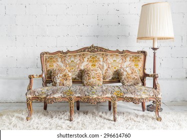 Classical style Armchair sofa couch in vintage room with desk lamp