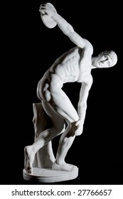 Classical white marble statue of naked discus thrower isolated on black background
