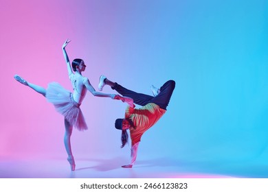 Classics meets modernity. Tender young girl, ballerina performing with expressive man showing hip hop dance style on gradient background in neon. Concept of classical and modern dance, performance - Powered by Shutterstock