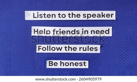 Classroom rules and values displayed on a bulletin board, promoting active listening, kindness, honesty, and discipline.