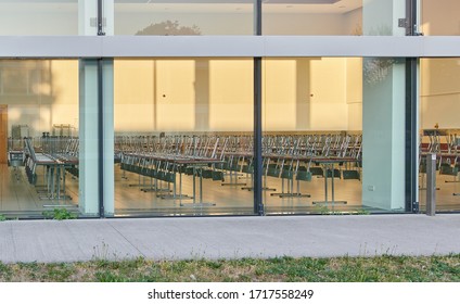 Classroom with stacked chairs for closing schools due to the crown virus - Shutterstock ID 1717558249