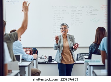 Classroom, teacher and science question at school university or college with dna model in education, learning and teaching. Physics professor with students happy for development or knowledge trust - Powered by Shutterstock