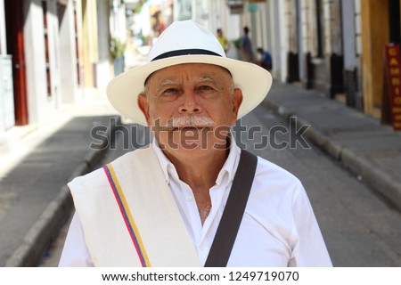 Classy Colombian elder man outdoors