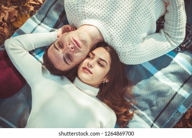 Classy Couple Is Spending The Day Outdoors, Lying In The Park, Enjoying The Day Together