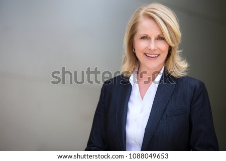 Classy distinguished blonde business woman professional executive attorney in a modern suit
