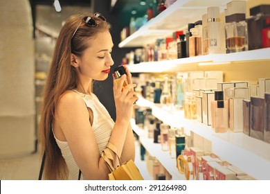 Classy woman choosing a perfume