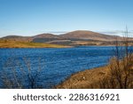 Clatteringshaws Loch on a sunny winters day, in Southern Scotland.